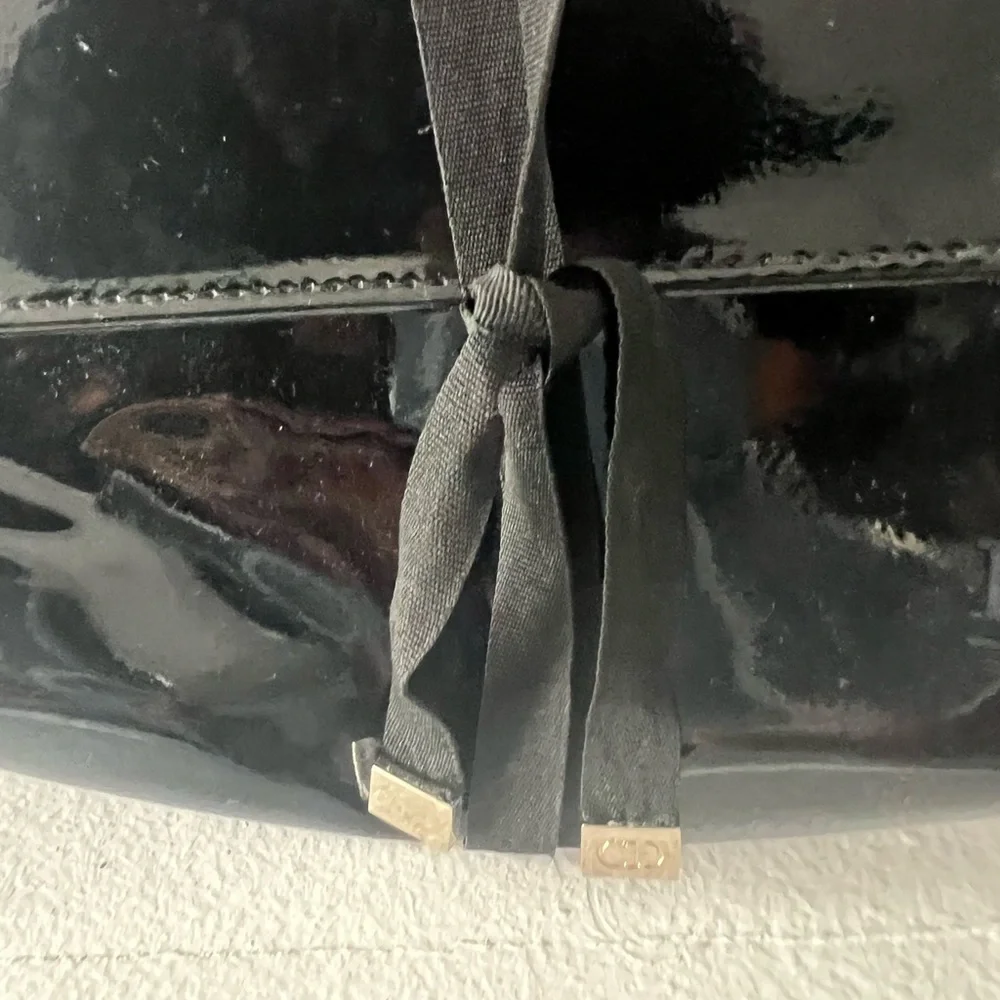 Dior Glossy Black Makeup Bag with Ribbon Detail.